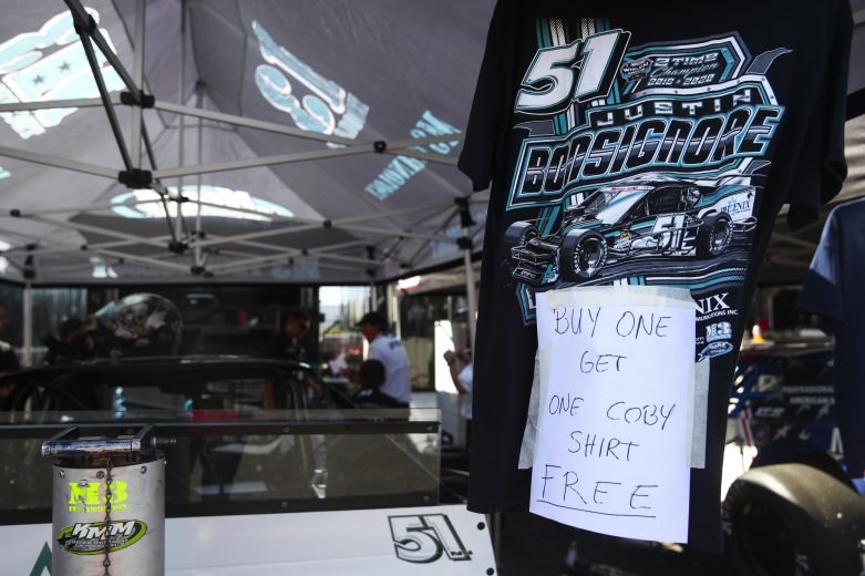 Justin Bonsignore, driver of the #51 Phoenix Communications Chevrolet, sells shirts during the Miller Lite 200 for the Whelen Modified Tour at Riverhead Raceway on September 18, 2021 in Riverhead, New York. (Adam Glanzman/NASCAR)