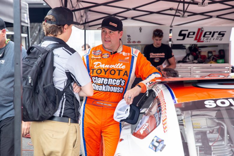 Peyton Sellers, driver of the Clarence’s Steakhouse and Danville Toyota #26 car, talks with crew during the NASCAR Advanced Auto Parts Weekly Series at Dominion Raceway on September 18, 2021 in Woodford, Virginia. (Parker Michels-Boyce/NASCAR)
