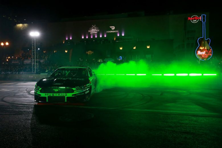 NASHVILLE, TENNESSEE - DECEMBER 01:  Aric Almirola, driver of the #10 NASCAR Cup Series Ford performs a burnout during the Burnouts on Broadway December 01, 2021 in Nashville, Tennessee. (Photo by Sean Gardner/Getty Images) | Getty Images