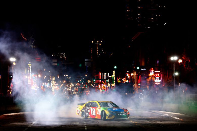 NASHVILLE, TENNESSEE - DECEMBER 01:  Kyle Busch, driver of the #18 NASCAR Cup Series Toyota performs a burnout during the Burnouts on Broadway December 01, 2021 in Nashville, Tennessee. (Photo by Jared C. Tilton/Getty Images) | Getty Images