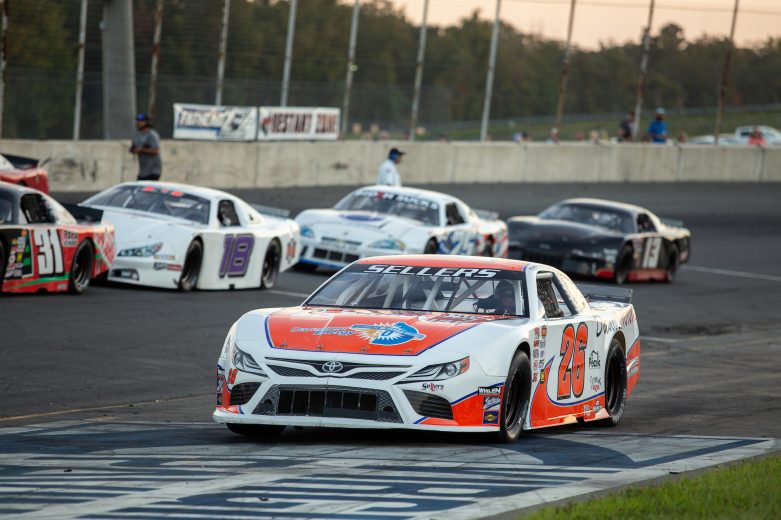 Peyton Sellers, driver of the #26 Clarences Steakhouse and Danville Toyota, and other drivers line up for the Late Model race during the NASCAR Advanced Auto Parts Weekly Series at Dominion Raceway on September 18, 2021 in Woodford, Virginia. (Parker Michels-Boyce/NASCAR)