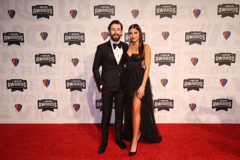 NASHVILLE, TENNESSEE - DECEMBER 02:  NASCAR Cup Series driver Ryan Blaney and guest Gianna Tulio pose on the red carpet prior to the NASCAR Champion's Banquet at the Music City Center on December 02, 2021 in Nashville, Tennessee. (Photo by Chris Graythen/Getty Images) | Getty Images