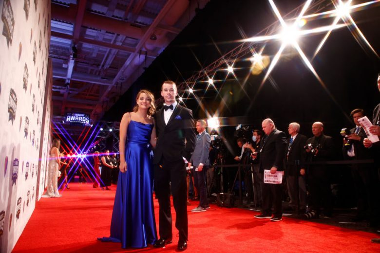 NASHVILLE, TENNESSEE - DECEMBER 02:  2021 NASCAR Camping World Truck Series championship driver, Ben Rhodes wife Caitlynn Rhodes pose on the red carpet prior to the NASCAR Champion's Banquet at the Music City Center on December 02, 2021 in Nashville, Tennessee. (Photo by Jared C. Tilton/Getty Images) | Getty Images
