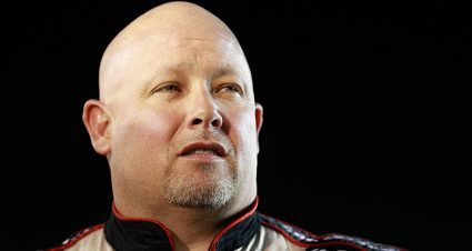 HOMESTEAD, FL - NOVEMBER 19: Todd Bodine, driver of the #30 Germain Racing Toyota, stands on the starting grid prior to the NASCAR Camping World Truck Series Ford 200 at Homestead-Miami Speedway on November 19, 2010 in Homestead, Florida. (Photo by Chris Graythen/Getty Images) | Getty Images