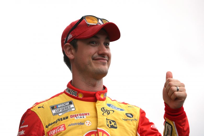 KANSAS CITY, KANSAS - OCTOBER 24: Joey Logano, driver of the #22 Shell Pennzoil Ford, gives a thumbs up to fans during pre-race ceremonies prior to the NASCAR Cup Series Hollywood Casino 400 at Kansas Speedway on October 24, 2021 in Kansas City, Kansas. (Photo by Sean Gardner/Getty Images) | Getty Images