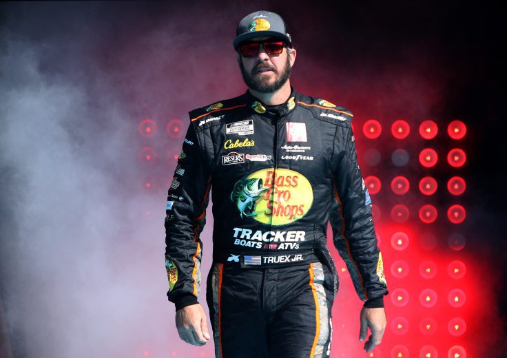 AVONDALE, ARIZONA - NOVEMBER 07: Martin Truex Jr., driver of the #19 Bass Pro Shops Toyota, walks onstage during pre-race ceremonies prior to the NASCAR Cup Series Championship at Phoenix Raceway on November 07, 2021 in Avondale, Arizona. (Photo by Sean Gardner/Getty Images) | Getty Images