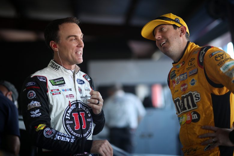 TALLADEGA, AL - OCTOBER 13: (L- R) Kevin Harvick, driver of the #4 Jimmy John's Ford, talks with Kyle Busch, driver of the #18 M&M's Toyota, in the garage during practice for the Monster Energy NASCAR Cup Series 1000Bulbs.com 500 at Talladega Superspeedway on October 13, 2018 in Talladega, Alabama. (Photo by Chris Graythen/Getty Images) | Getty Images
