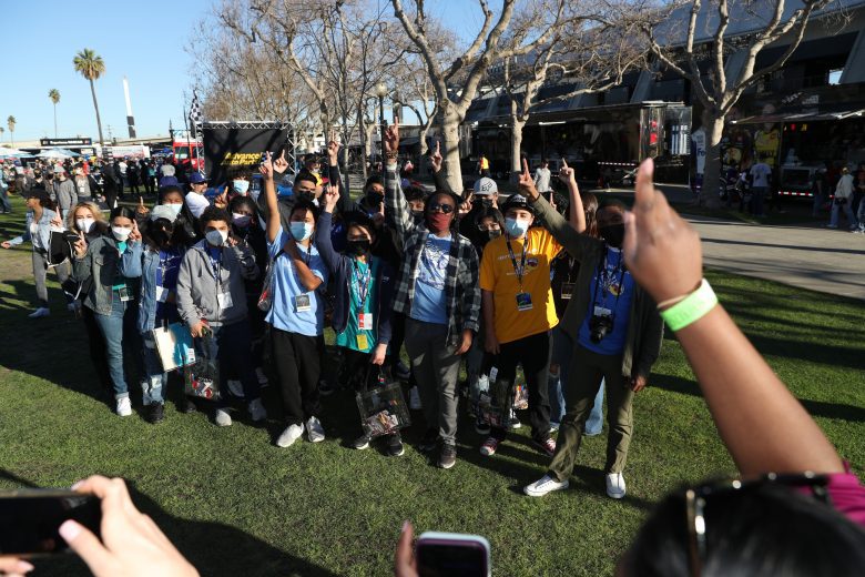 LOS ANGELES, CALIFORNIA - FEBRUARY 05: Boys & Girls Clubs of Carson kids receiving a tour around the track, which includes touring through the garage area and track walk. Kids interacting with a Cup driver during the tour. at Los Angeles Memorial Coliseum on February 05, 2022 in Los Angeles, California. (Photo by Meg Oliphant/Getty Images)