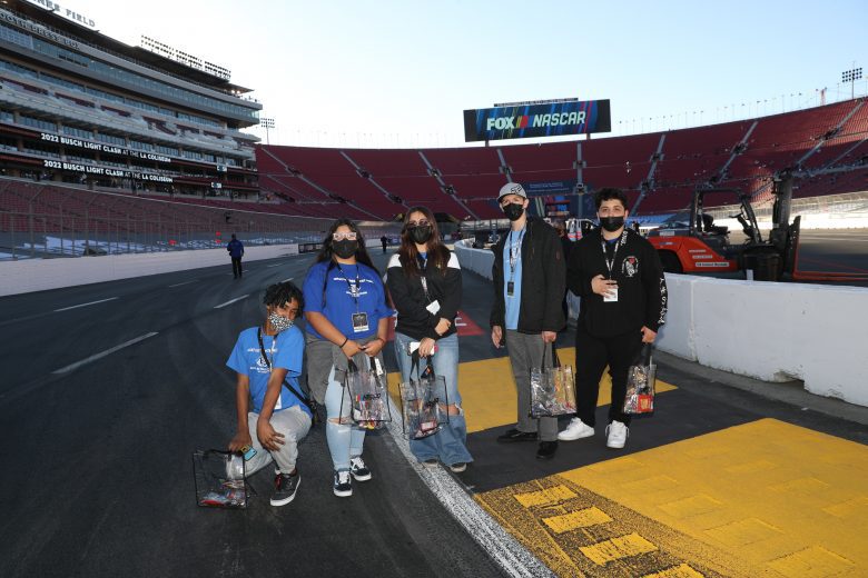 LOS ANGELES, CALIFORNIA - FEBRUARY 05: Boys & Girls Clubs of Carson kids receiving a tour around the track, which includes touring through the garage area and track walk. Kids interacting with a Cup driver during the tour. at Los Angeles Memorial Coliseum on February 05, 2022 in Los Angeles, California. (Photo by Meg Oliphant/Getty Images)