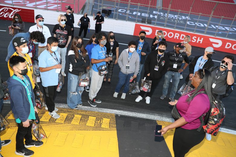 LOS ANGELES, CALIFORNIA - FEBRUARY 05: Boys & Girls Clubs of Carson kids receiving a tour around the track, which includes touring through the garage area and track walk. Kids interacting with a Cup driver during the tour. at Los Angeles Memorial Coliseum on February 05, 2022 in Los Angeles, California. (Photo by Meg Oliphant/Getty Images)