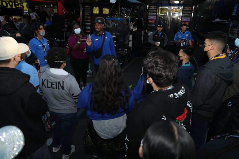 LOS ANGELES, CALIFORNIA - FEBRUARY 05: Boys & Girls Clubs of Carson kids receiving a tour around the track, which includes touring through the garage area and track walk. Kids interacting with a Cup driver during the tour. at Los Angeles Memorial Coliseum on February 05, 2022 in Los Angeles, California. (Photo by Meg Oliphant/Getty Images)