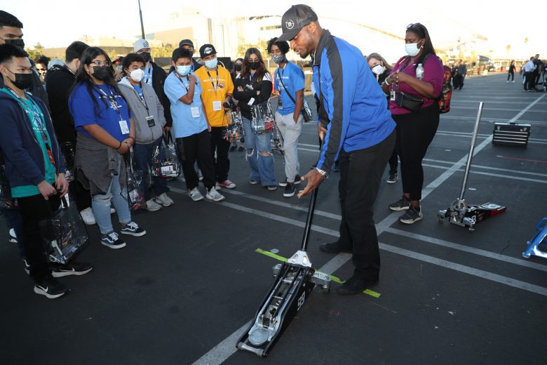 LOS ANGELES, CALIFORNIA - FEBRUARY 05: Boys & Girls Clubs of Carson kids receiving a tour around the track, which includes touring through the garage area and track walk. Kids interacting with a Cup driver during the tour. at Los Angeles Memorial Coliseum on February 05, 2022 in Los Angeles, California. (Photo by Meg Oliphant/Getty Images)