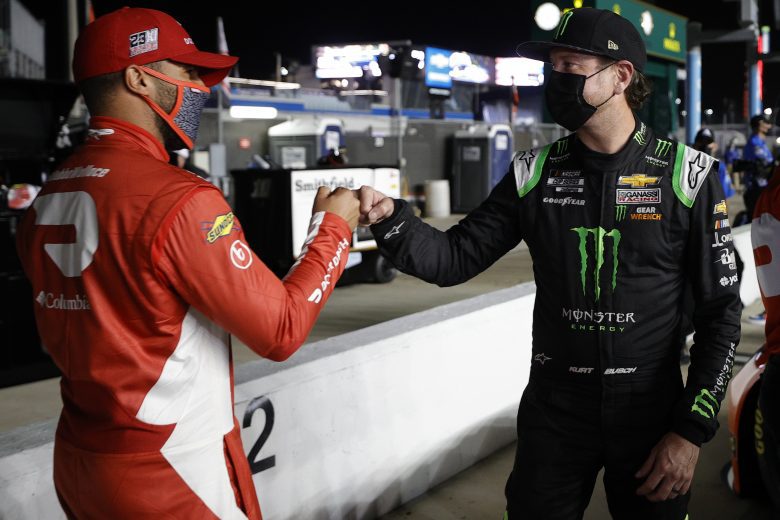 DAYTONA BEACH, FLORIDA - FEBRUARY 10: Kurt Busch, driver of the #1 Monster Energy Chevrolet, and Bubba Wallace, driver of the #23 DoorDash Toyota, fist bump during qualifying for the NASCAR Cup Series 63rd Annual Daytona 500 at Daytona International Speedway on February 10, 2021 in Daytona Beach, Florida. (Photo by Chris Graythen/Getty Images) | Getty Images