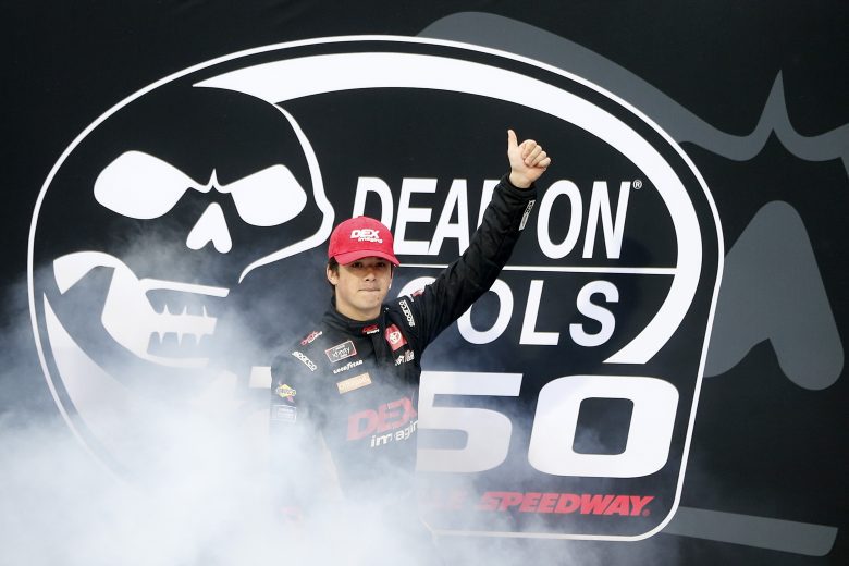 MARTINSVILLE, VIRGINIA - OCTOBER 30: Harrison Burton, driver of the #20 DEX Imaging Toyota, gives a thumbs up to fans as he walks onstage during pre-race ceremonies prior to the NASCAR Xfinity Series Dead on Tools 250 at Martinsville Speedway on October 30, 2021 in Martinsville, Virginia. (Photo by Brian Lawdermilk/Getty Images) | Getty Images