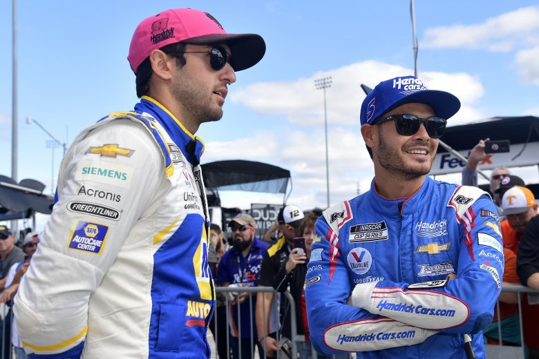 MARTINSVILLE, VIRGINIA - OCTOBER 31: Chase Elliott, driver of the #9 NAPA Auto Parts Chevrolet, (L) and Kyle Larson, driver of the #5 HendrickCars.com Chevrolet, talk on the grid prior to the NASCAR Cup Series Xfinity 500 at Martinsville Speedway on October 31, 2021 in Martinsville, Virginia. (Photo by Logan Riely/Getty Images) | Getty Images