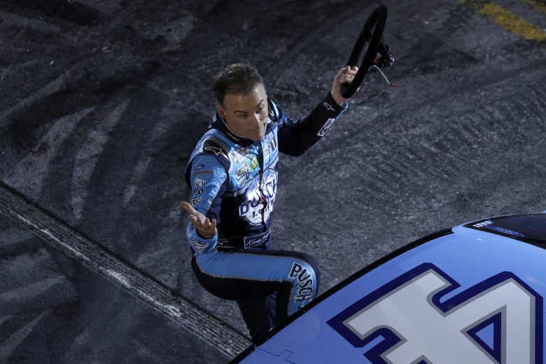NASHVILLE, TENNESSEE - DECEMBER 01: Kevin Harvick, driver of the #4 NASCAR Cup Series Ford exits his car during the Burnouts on Broadway December 01, 2021 in Nashville, Tennessee. (Photo by Brett Carlsen/Getty Images) | Getty Images