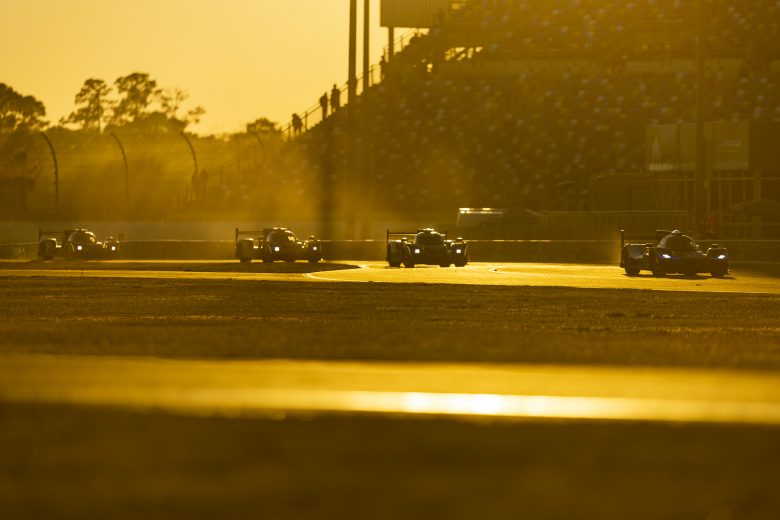 DAYTONA BEACH, FLORIDA - JANUARY 29: Cars race during sunset at the Rolex 24 at Daytona International Speedway on January 29, 2022 in Daytona Beach, Florida. (Photo by James Gilbert/Getty Images) | Getty Images