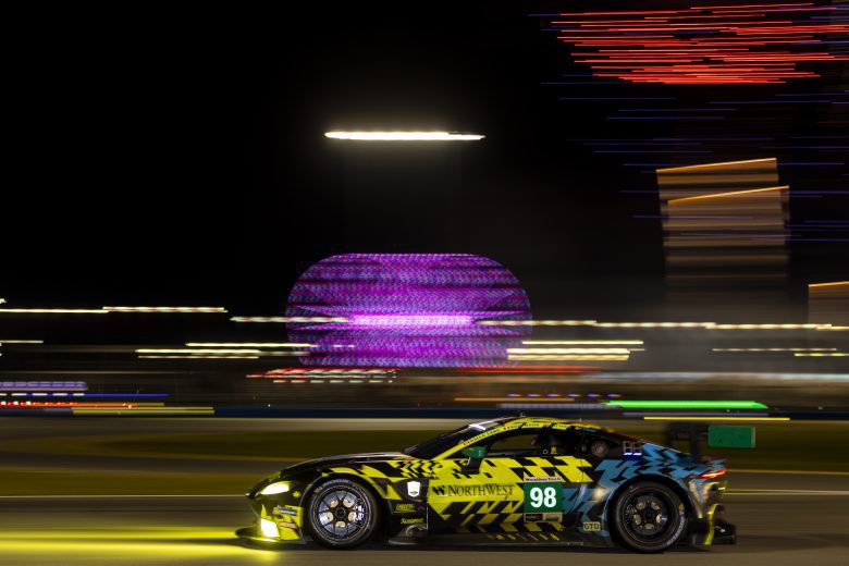DAYTONA BEACH, FLORIDA - JANUARY 29: The #98 Northwest AMR Aston Martin Vantage GT3 of Paul Dalla Lana, David Pittard, Charlie Eastwood, and Nicki Thiim drives as fireworks are seen during the Rolex 24 at Daytona International Speedway on January 29, 2022 in Daytona Beach, Florida. (Photo by James Gilbert/Getty Images) | Getty Images