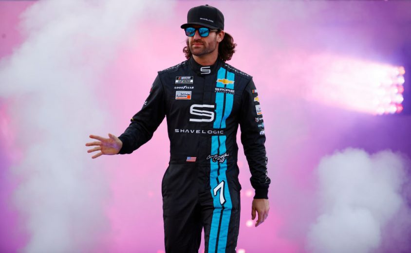 RICHMOND, VIRGINIA - SEPTEMBER 11: Corey LaJoie, driver of the #7 Shavelogic Chevrolet, waves to fans during pre-race ceremonies prior to the NASCAR Cup Series Federated Auto Parts 400 Salute to First Responders at Richmond Raceway on September 11, 2021 in Richmond, Virginia. (Photo by Jared C. Tilton/Getty Images) | Getty Images