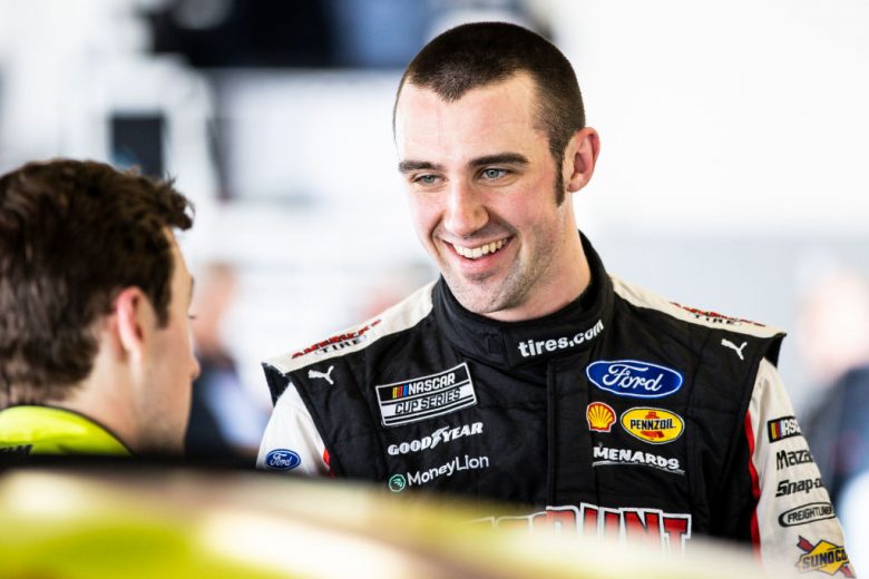 DAYTONA BEACH, FLORIDA - JANUARY 12: Austin Cindric, driver of the #2 Team Penske Ford, talks with Ryan Blaney, driver of the #12 Team Penske Ford in the garage during the NASCAR Next Gen Test at Daytona International Speedway on January 12, 2022 in Daytona Beach, Florida. (Photo by James Gilbert/Getty Images) | Getty Images
