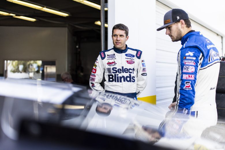 DAYTONA BEACH, FLORIDA - JANUARY 12: David Ragan talks with Todd Gilliland in the garage during the NASCAR Next Gen Test at Daytona International Speedway on January 12, 2022 in Daytona Beach, Florida. (Photo by James Gilbert/Getty Images) | Getty Images
