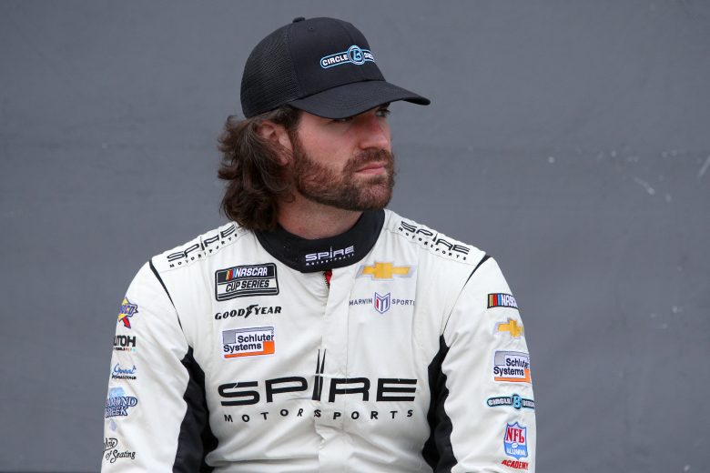 KANSAS CITY, KANSAS - OCTOBER 24: Corey LaJoie, driver of the #7 Circle B Diecast Chevrolet, waits backstage during pre-race ceremonies prior to the NASCAR Cup Series Hollywood Casino 400 at Kansas Speedway on October 24, 2021 in Kansas City, Kansas. (Photo by Sean Gardner/Getty Images) | Getty Images