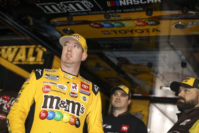 LOS ANGELES, CALIFORNIA - FEBRUARY 05: Kyle Busch, driver of the #18 M&M's Toyota, stands at his hauler after setting the fastest lap in qualifying for the NASCAR Cup Series Busch Light Clash at Los Angeles Memorial Coliseum on February 05, 2022 in Los Angeles, California. (Photo by Meg Oliphant/Getty Images)