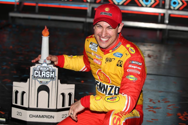 LOS ANGELES, CALIFORNIA - FEBRUARY 06: Joey Logano, driver of the #22 Shell Pennzoil Ford, poses with the trophy in victory lane after winning the NASCAR Cup Series Busch Light Clash at the Los Angeles Memorial Coliseum on February 06, 2022 in Los Angeles, California. (Photo by Meg Oliphant/Getty Images) | Getty Images