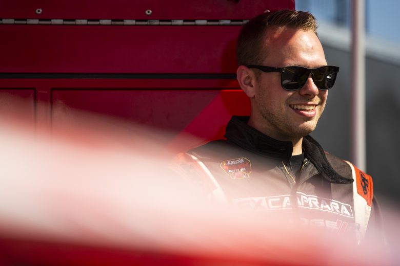 Tommy Catalano, driver of the #54 FX Caprara Chevrolet, looks on during the New Smyrna Visitors Bureau 200 for the NASCAR Whelen Modified Tour during night 2 of the World Series of Asphalt Stock Car Racing at New Smyrna Speedway in New Smyrna, Florida on February 12, 2022. (Adam Glanzman/NASCAR)