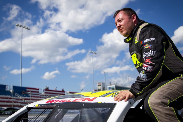 Patrick Emerling, driver of the #7 Captain Pips Marina & Hideaway Car, enters his car during the New Smyrna Visitors Bureau 200 for the NASCAR Whelen Modified Tour during night 2 of the World Series of Asphalt Stock Car Racing at New Smyrna Speedway in New Smyrna, Florida on February 12, 2022. (Adam Glanzman/NASCAR)