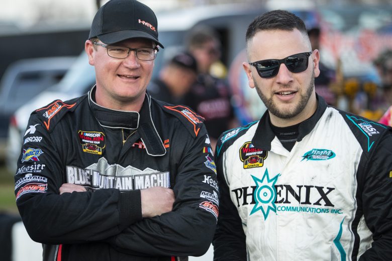 Ron Silk, driver of the #16 Blue Mountain Machine and Future Homes Car,  and Justin Bonsignore, driver of the #51 Phoenix Communications, Inc. Chevrolet, look on during the New Smyrna Visitors Bureau 200 for the NASCAR Whelen Modified Tour during night 2 of the World Series of Asphalt Stock Car Racing at New Smyrna Speedway in New Smyrna, Florida on February 12, 2022. (Adam Glanzman/NASCAR)