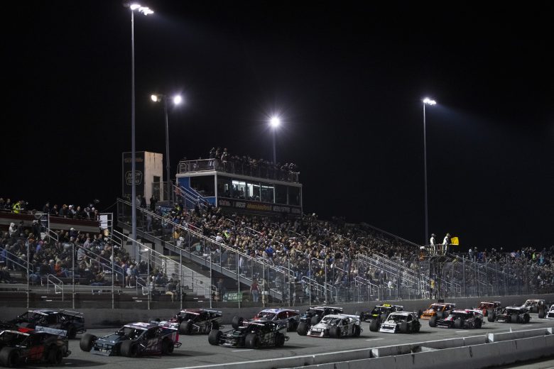 Cars race during the New Smyrna Visitors Bureau 200 for the NASCAR Whelen Modified Tour during night 2 of the World Series of Asphalt Stock Car Racing at New Smyrna Speedway in New Smyrna, Florida on February 12, 2022. (Adam Glanzman/NASCAR)