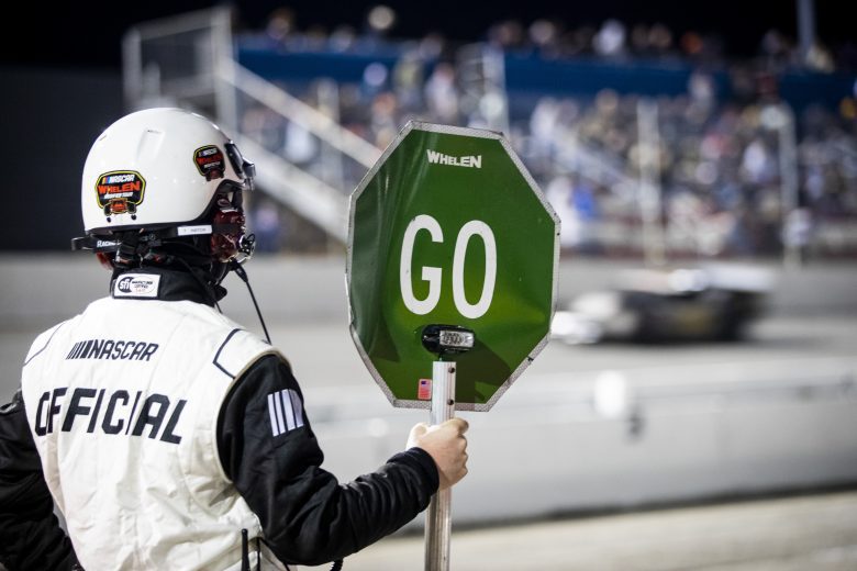 An official looks on during the New Smyrna Visitors Bureau 200 for the NASCAR Whelen Modified Tour during night 2 of the World Series of Asphalt Stock Car Racing at New Smyrna Speedway in New Smyrna, Florida on February 12, 2022. (Adam Glanzman/NASCAR)