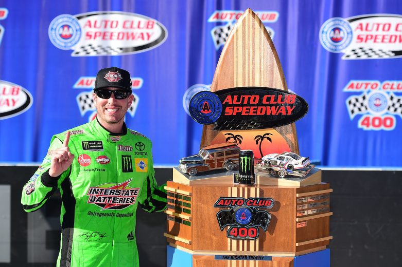 FONTANA, CALIFORNIA - MARCH 17: Kyle Busch, driver of the #18 Interstate Batteries Toyota, celebrates in victory lane after winning the Monster Energy NASCAR Cup Series Auto Club 400 and winning his 200th NASCAR race at Auto Club Speedway on March 17, 2019 in Fontana, California. (Photo by Jared C. Tilton/Getty Images) | Getty Images
