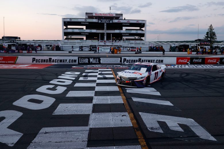 LONG POND, PENNSYLVANIA - JUNE 28: Denny Hamlin, driver of the #11 FedEx Ground Toyota, celebrates after winning the NASCAR Cup Series Pocono 350 at Pocono Raceway on June 28, 2020 in Long Pond, Pennsylvania. (Photo by Patrick Smith/Getty Images) | Getty Images