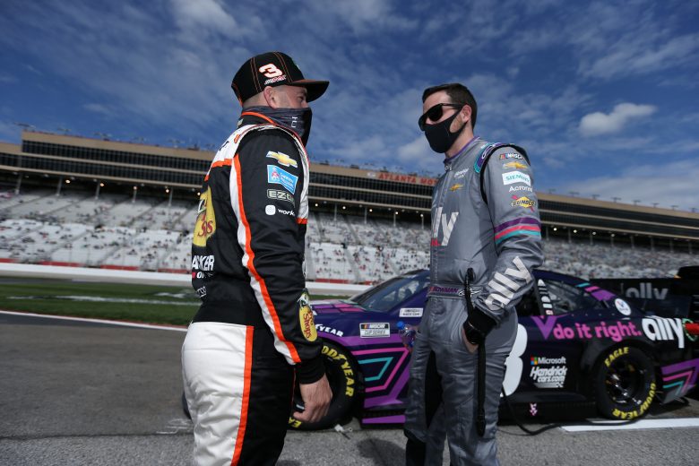 HAMPTON, GEORGIA - MARCH 21: Austin Dillon, driver of the #3 Bass Pro Shops/Tracker Off Road Chevrolet, and Alex Bowman, driver of the #48 Ally Chevrolet, talk onthe grid prior to the NASCAR Cup Series Folds of Honor QuikTrip 500 at Atlanta Motor Speedway on March 21, 2021 in Hampton, Georgia. (Photo by Sean Gardner/Getty Images) | Getty Images