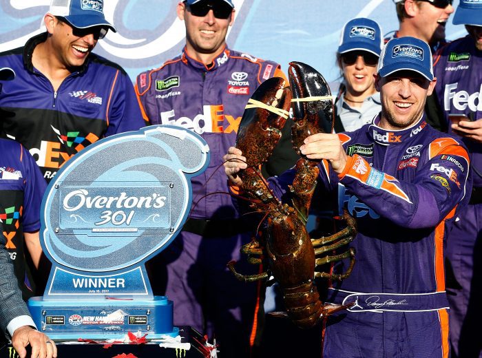 LOUDON, NH - JULY 16:  Denny Hamlin, driver of the #11 FedEx Office Toyota, poses with a lobster in Victory Lane after winning the Monster Energy NASCAR Cup Series Overton's 301 at New Hampshire Motor Speedway on July 16, 2017 in Loudon, New Hampshire.  (Photo by Jeff Zelevansky/Getty Images) | Getty Images