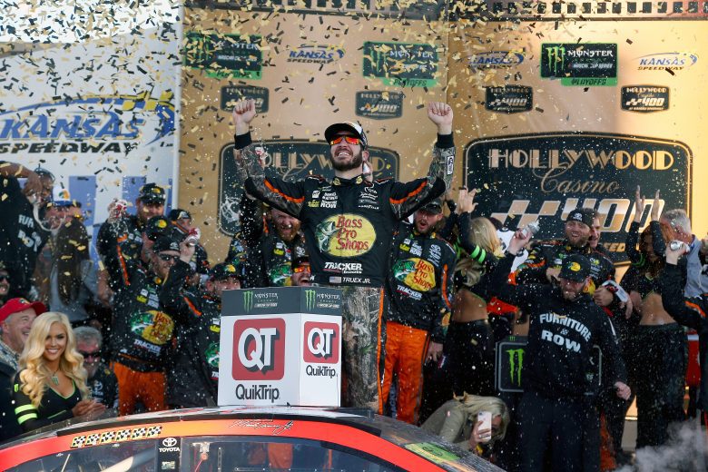 KANSAS CITY, KS - OCTOBER 22:  Martin Truex Jr., driver of the #78 Bass Pro Shops/Tracker Boats Toyota, celebrates in Victory Lane after winning the Monster Energy NASCAR Cup Series Hollywood Casino 400 at Kansas Speedway on October 22, 2017 in Kansas City, Kansas.  (Photo by Sarah Crabill/Getty Images) | Getty Images