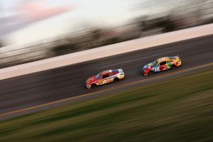 DAYTONA BEACH, FLORIDA - FEBRUARY 20: Bubba Wallace, driver of the #23 McDonald's Toyota, and Kyle Busch, driver of the #18 M&M's Toyota, race during the NASCAR Cup Series 64th Annual Daytona 500 at Daytona International Speedway on February 20, 2022 in Daytona Beach, Florida. (Photo by James Gilbert/Getty Images) | Getty Images