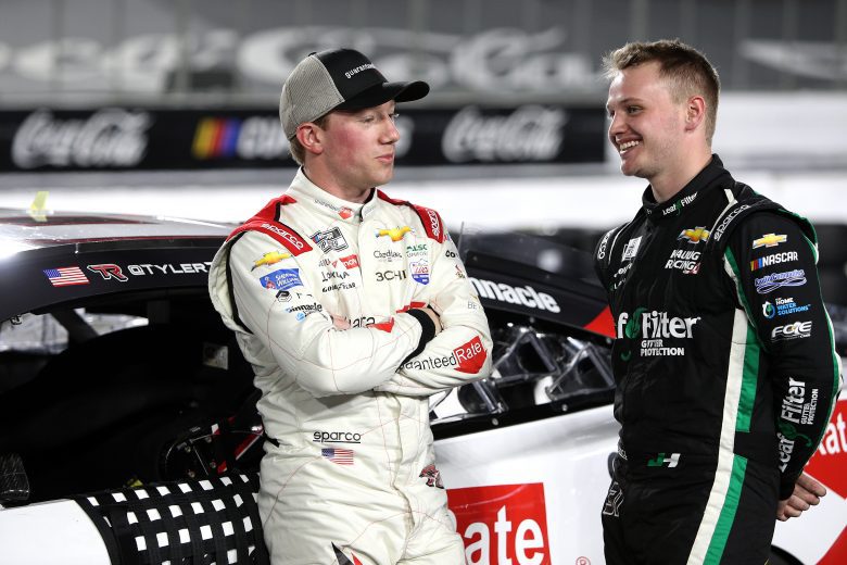LOS ANGELES, CALIFORNIA - FEBRUARY 05: Tyler Reddick, driver of the #8 Guaranteed Rate Chevrolet, (L) and  Justin Haley, driver of the #31 LeafFilter Gutter Protection Chevrolet,  talk on the grid during qualifying for the NASCAR Cup Series Busch Light Clash at Los Angeles Memorial Coliseum on February 05, 2022 in Los Angeles, California. (Photo by Sean Gardner/Getty Images) | Getty Images