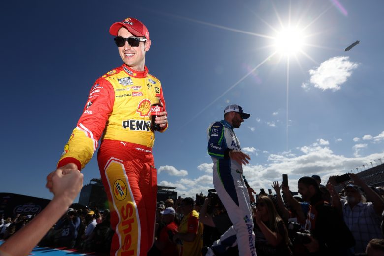 DAYTONA BEACH, FLORIDA - FEBRUARY 20: Joey Logano, driver of the #22 Shell Pennzoil Ford, greets  fans onstage during the driver intros prior to the NASCAR Cup Series 64th Annual Daytona 500 at Daytona International Speedway on February 20, 2022 in Daytona Beach, Florida. (Photo by James Gilbert/Getty Images) | Getty Images
