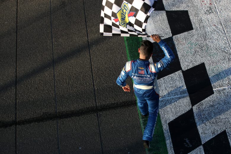 FONTANA, CALIFORNIA - FEBRUARY 27: Kyle Larson, driver of the #5 HendrickCars.com Chevrolet, celebrates with the checkered flag after winning the NASCAR Cup Series Wise Power 400 at Auto Club Speedway on February 27, 2022 in Fontana, California. (Photo by Meg Oliphant/Getty Images) | Getty Images