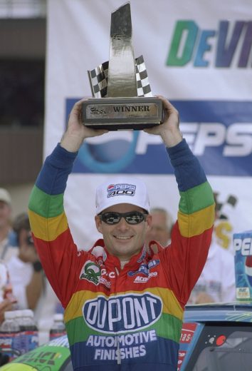 16 Aug 1998: Driver Jeff Gordon #24 holds up the trophy after winning the Pepsi 400 at the Michigan Speedway in Brooklyn, Michigan.