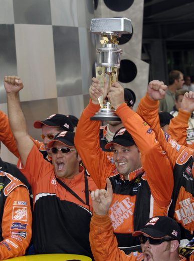 INDIANAPOLIS - AUGUST 7: Tony Stewart, driver of the #20 Home Depot Chevrolet, celebrates winning the NASCAR Nextel Cup Series Allstate 400 on August 7, 2005 at the Indianapolis Motor Speedway in Indianapolis, Indiana. (Photo by Rusty Jarrett/Getty Images) | Getty Images
