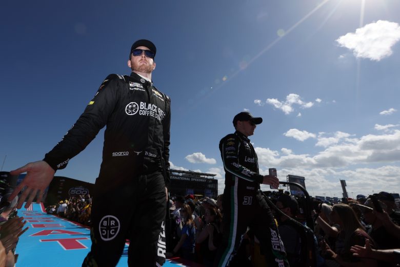 DAYTONA BEACH, FLORIDA - FEBRUARY 20: Ty Dillon, driver of the #42 Black Rifle Coffee Company Chevrolet, (L) and Justin Haley, driver of the #31 LeafFilter Gutter Protection Chevrolet, greet fans onstage during driver intros prior to the NASCAR Cup Series 64th Annual Daytona 500 at Daytona International Speedway on February 20, 2022 in Daytona Beach, Florida. (Photo by James Gilbert/Getty Images) | Getty Images