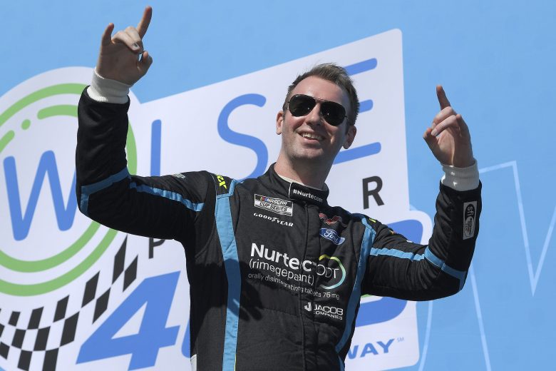 FONTANA, CA - FEBRUARY 27: Cody Ware, driver of the #51 Nurtec ODT Ford, waves to fans as he walks onstage during driver intros prior to the NASCAR Cup Series Wise Power 400 at Auto Club Speedway on February 27, 2022 in Fontana, California. (Photo by Kevork Djansezian/Getty Images) | Getty Images