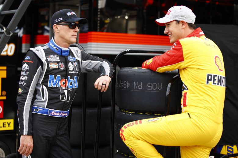 CONCORD, NORTH CAROLINA - MAY 28: Kevin Harvick, driver of the #4 Mobil 1 Ford, and Joey Logano, driver of the #22 Shell Pennzoil Ford, talk in the garage area during practice for the NASCAR Cup Series Coca-Cola 600 at Charlotte Motor Speedway on May 28, 2021 in Concord, North Carolina. (Photo by Jared C. Tilton/Getty Images) | Getty Images