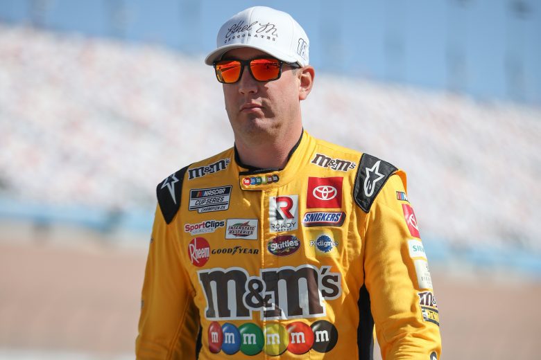 LAS VEGAS, NEVADA - MARCH 05: Kyle Busch, driver of the #18 Ethel M Chocolates Toyota, walks the grid during practice for NASCAR Cup Series Pennzoil 400 at Las Vegas Motor Speedway on March 05, 2022 in Las Vegas, Nevada. (Photo by Meg Oliphant/Getty Images) | Getty Images