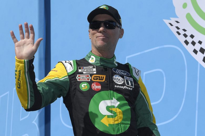 FONTANA, CALIFORNIA - FEBRUARY 27: Kevin Harvick, driver of the #4 Subway Ford, waves to fans as he walks onstage during driver intros prior to the NASCAR Cup Series Wise Power 400 at Auto Club Speedway on February 27, 2022 in Fontana, California. (Photo by Kevork Djansezian/Getty Images) | Getty Images