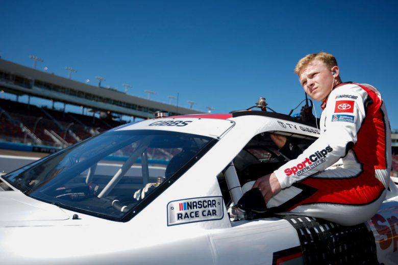 AVONDALE, ARIZONA - MARCH 12: Ty Gibbs, driver of the #54 Sports Clips Haircuts Toyota, enters his car during qualifying for the NASCAR Xfinity Series United Rentals 200 at Phoenix Raceway on March 12, 2022 in Avondale, Arizona. (Photo by Sean Gardner/Getty Images) | Getty Images